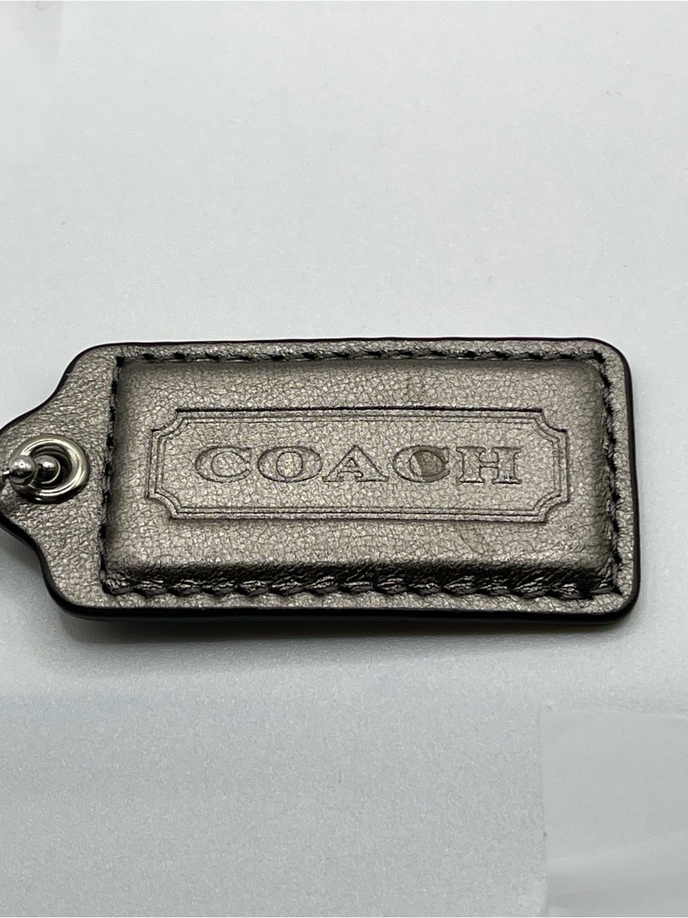 COACH Gray Iridescent Leather Embossed Hang Tag